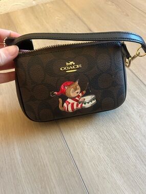 Coach Brown Signature Wristlet with Festive Cat Drummer Graphic